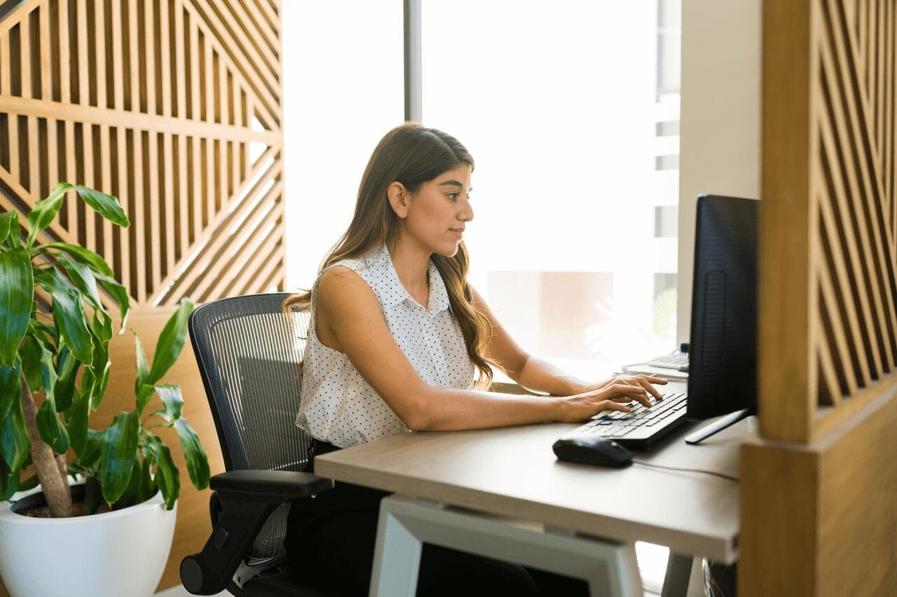 Employee working at a desk with a computer